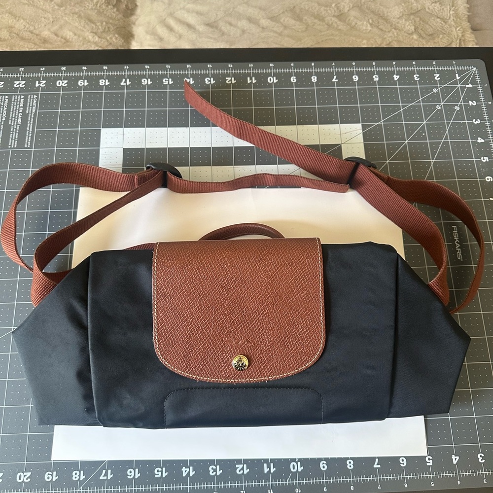 Longchamp Black and Tan Bag with Gold Accents